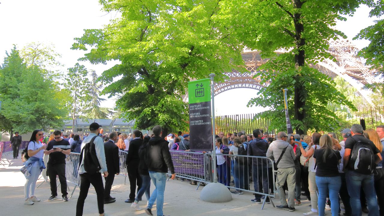 PARIS FRANCE - MAY 23, 2019: Unidentified people queue to enter Eiffel tower in Paris France.