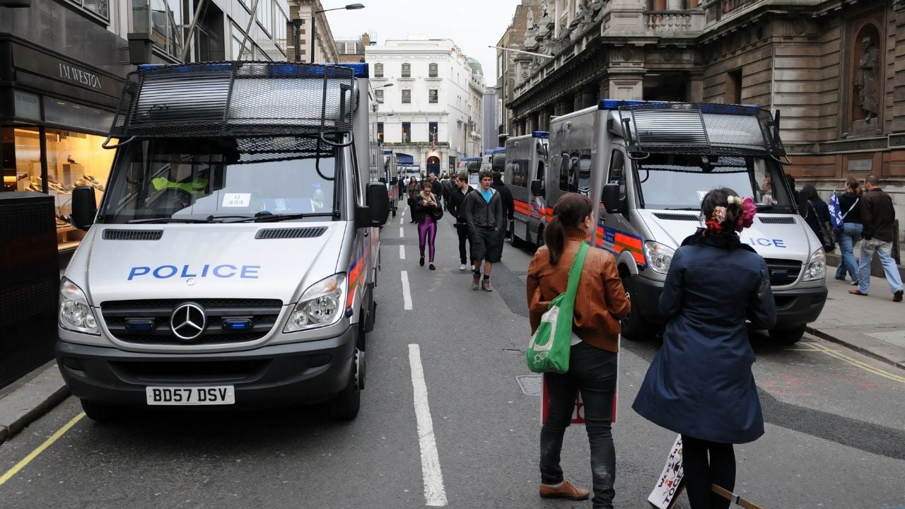 Police in vans respond to an incident after violent clashes during a large anti government rally on March 26, 2011 in London, UK. Numerous arrests were made after violent clashes with police.
