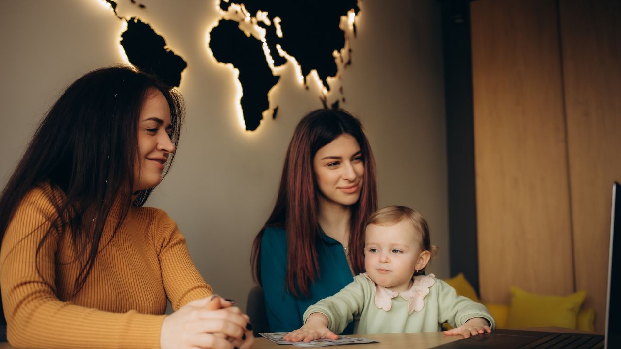 a young mother chooses a vacation in a travel agency