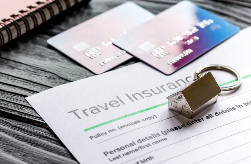 Travel preparation concept with insurance and cards on wooden table
