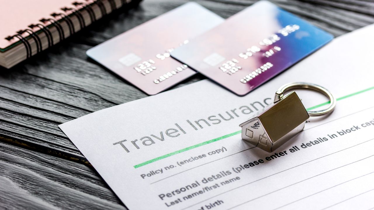 Travel preparation concept with insurance and cards on wooden table