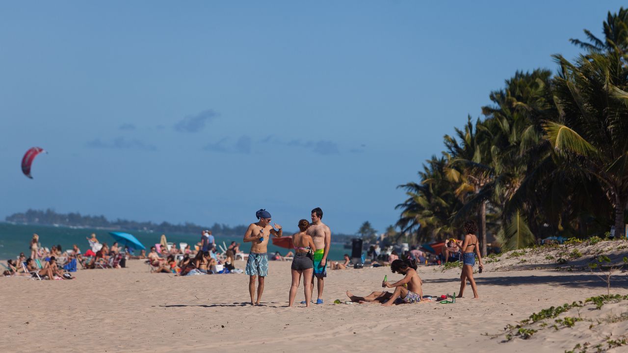 SAN JUAN, PUERTO RICO - JAN 16TH, 2016 - People enjoying a sunny day at the beach in San Juan. Puerto Rico is a popular winter destination for many tourists from North America and Europe.