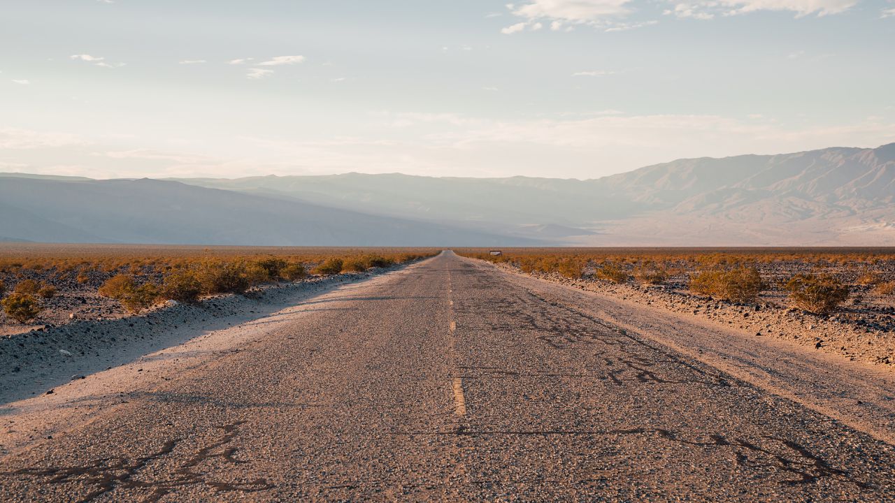 Endless Route 66 Highway Through Desert Landscape