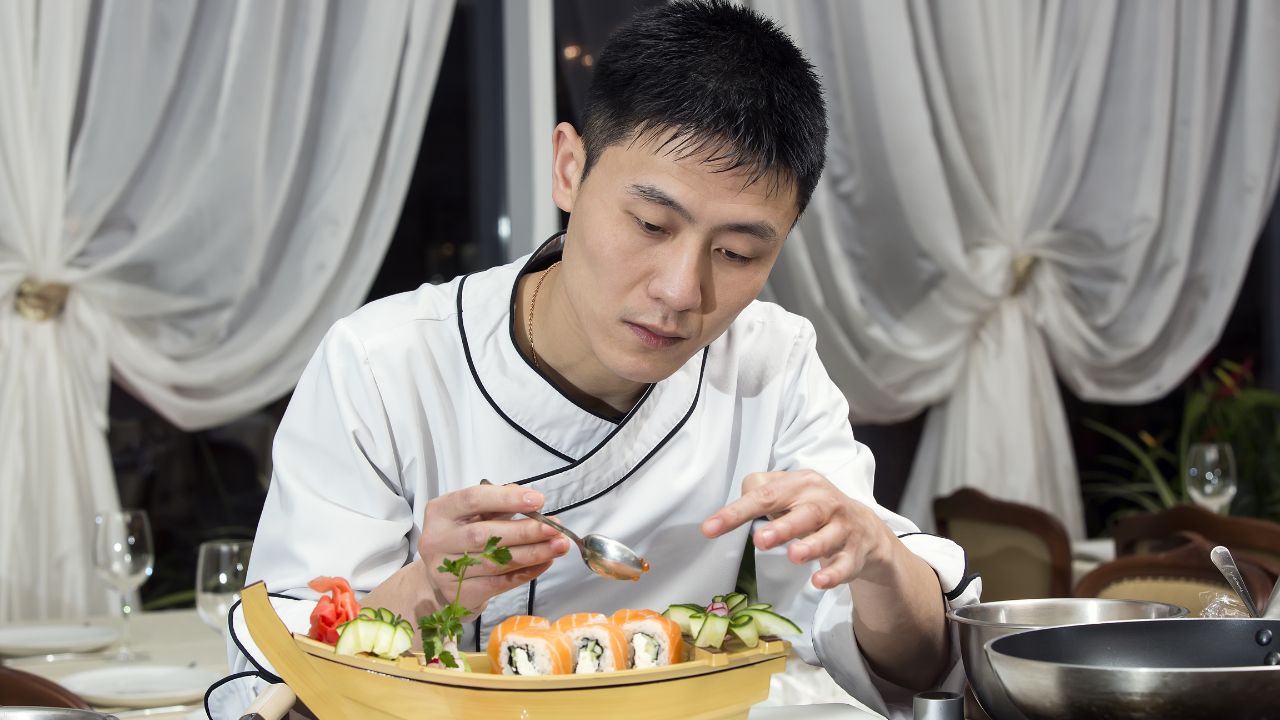 Japanese chef preparing a meal in a restaurant