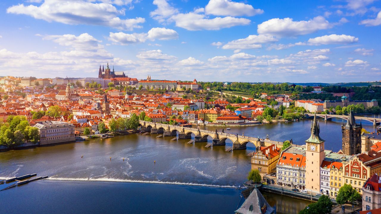 Scenic view of the Old Town pier architecture and Charles Bridge over Vltava river in Prague, Czech Republic. Prague iconic Charles Bridge (Karluv Most) and Old Town Bridge Tower at sunset, Czechia.