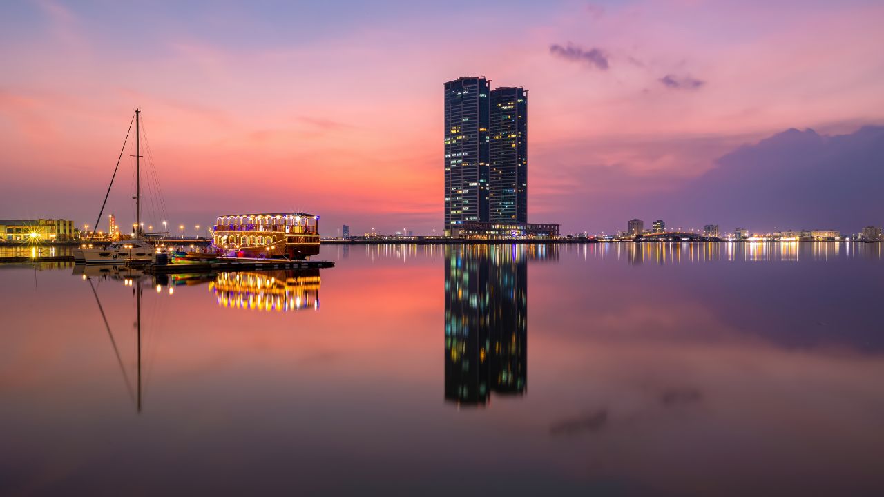Ras Al Khaimah Boat and DhowCruise bay with harbour in background with Sunset Reflection