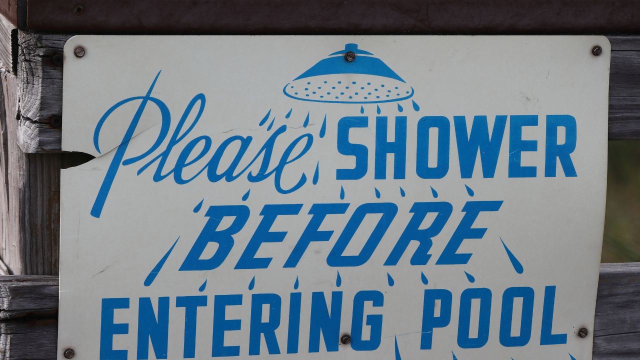 Please Shower Before Entering Pool sign