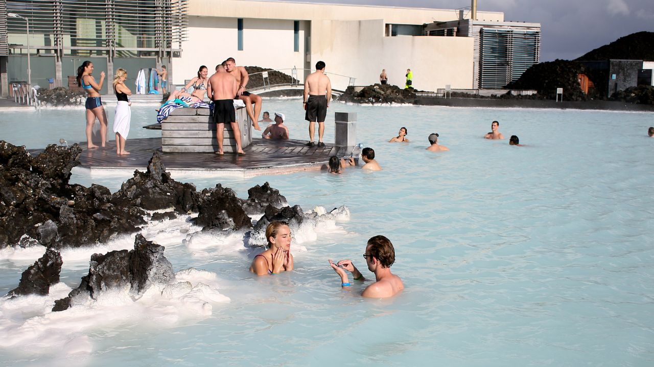 Reykjavik, Iceland - September 19 2011 - Tourists and locals enjoying swimming in the waters of the Blue Lagoon, a geothermal spa in southwestern Iceland.