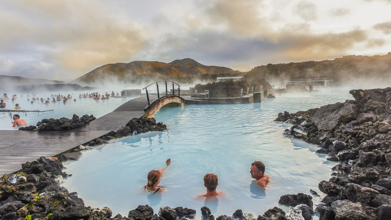 Reykjanes Peninsula, Iceland -October 17, 2018:Landscape View Of The Beautiful Hot Spring/ Blue Lagoon With Crowds of People At Sunset