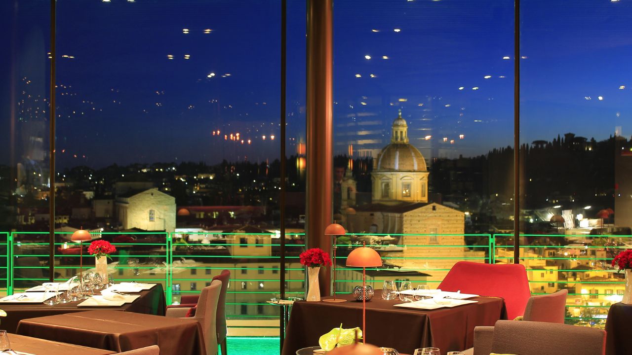 Elegant riverside dining setting in Florence