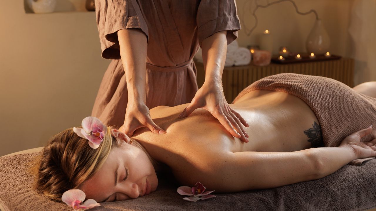 Woman receiving a professional back massage in a spa