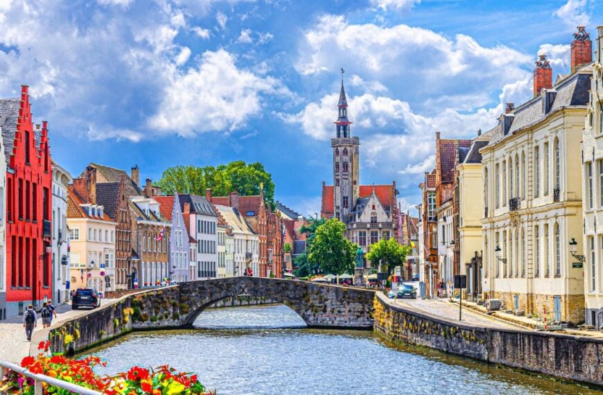 Bruges cityscape, Spiegelrei water canal, Poortersloge tower, King's Bridge and medieval buildings on embankment, Brugge old town quarter, Bruges city historic centre, West Flanders province, Belgium