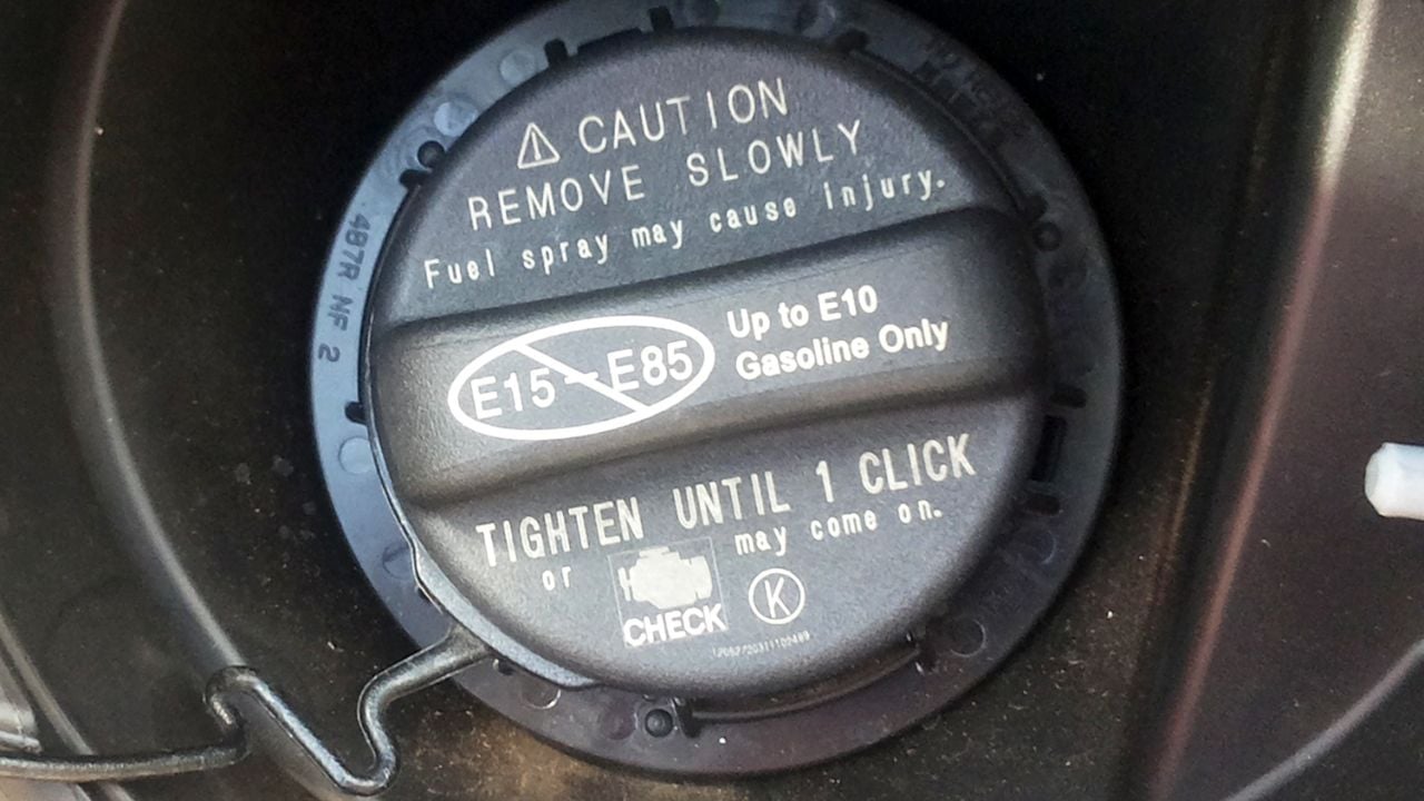 2012 Toyota Camry Hybrid fuel filler cap showing warning regarding the maximum ethanol blend allowed by the carmaker, up to E10 gasoline.