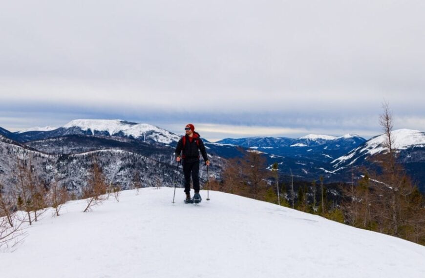 a hiker snowshoes on mont olivine in the chic choc mountains of gaspesie national park