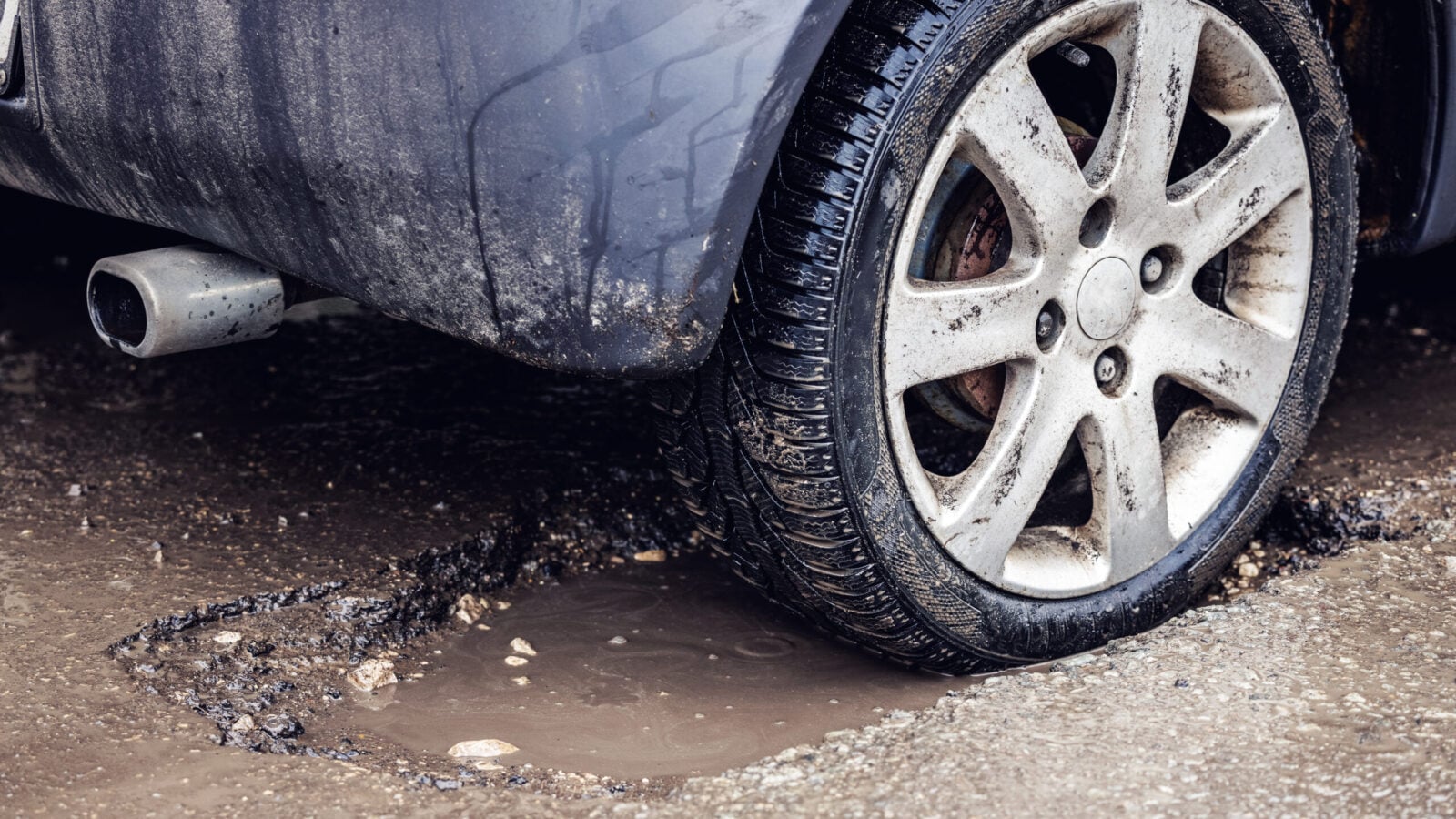 car stuck in pothole