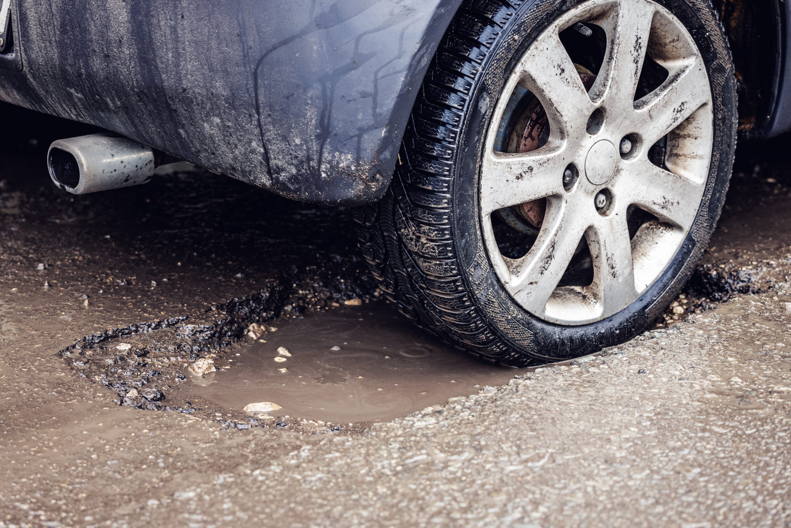 car stuck in pothole