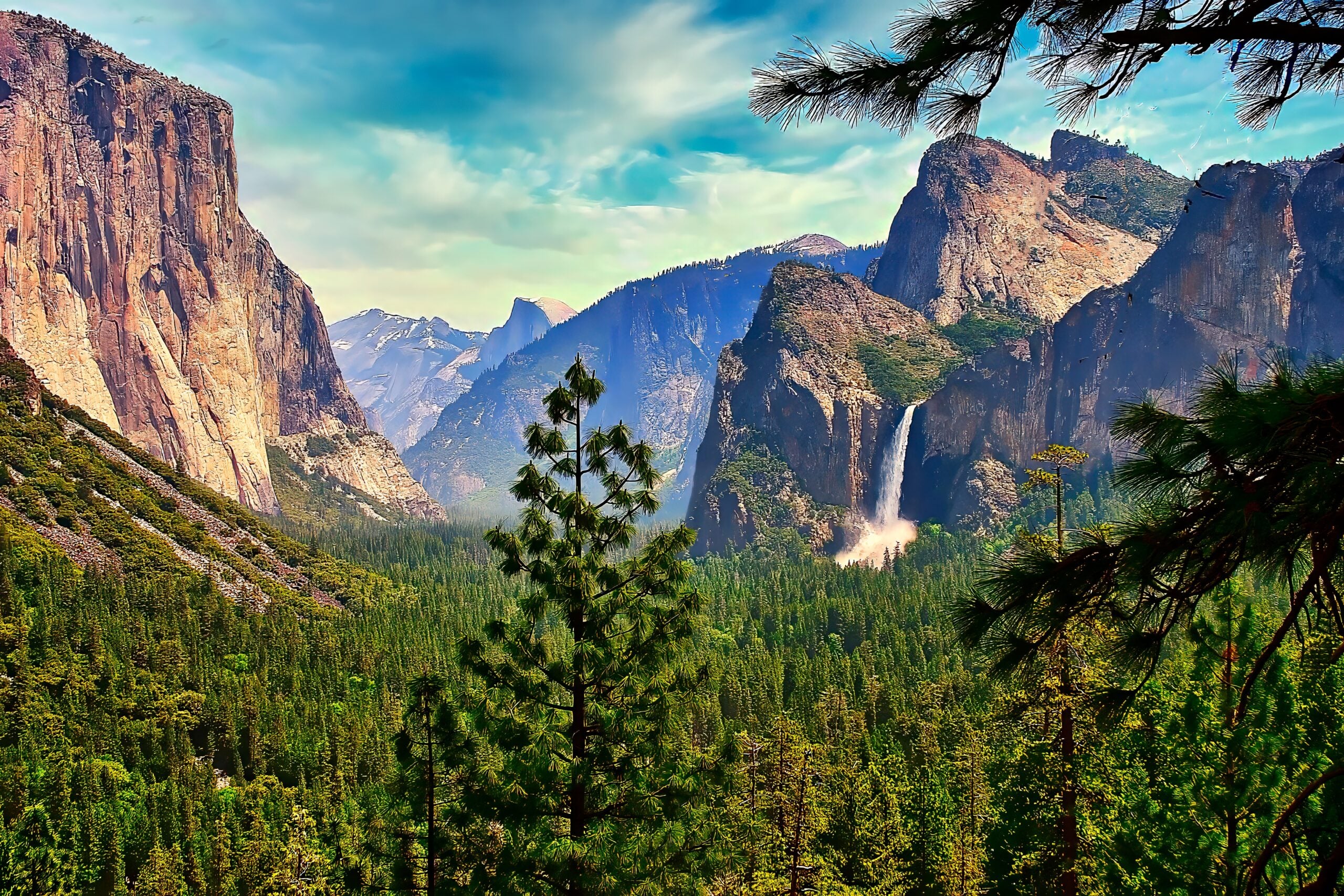 A panoramic view of the iconic Yosemite Valley in the Springtime, showing Bridalveil Falls and El Capitan.