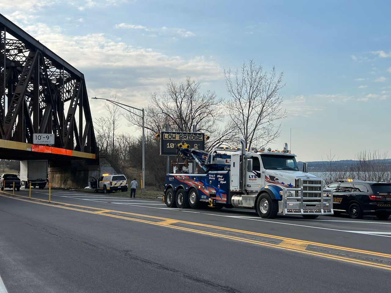 truck stuck under bridge help