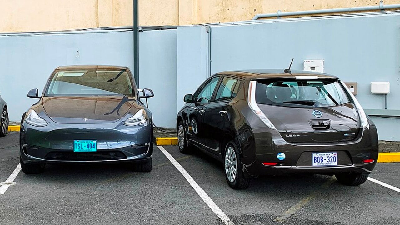Tesla Model Y and Nissan Leaf all-electric cars in San Jose, Costa Rica