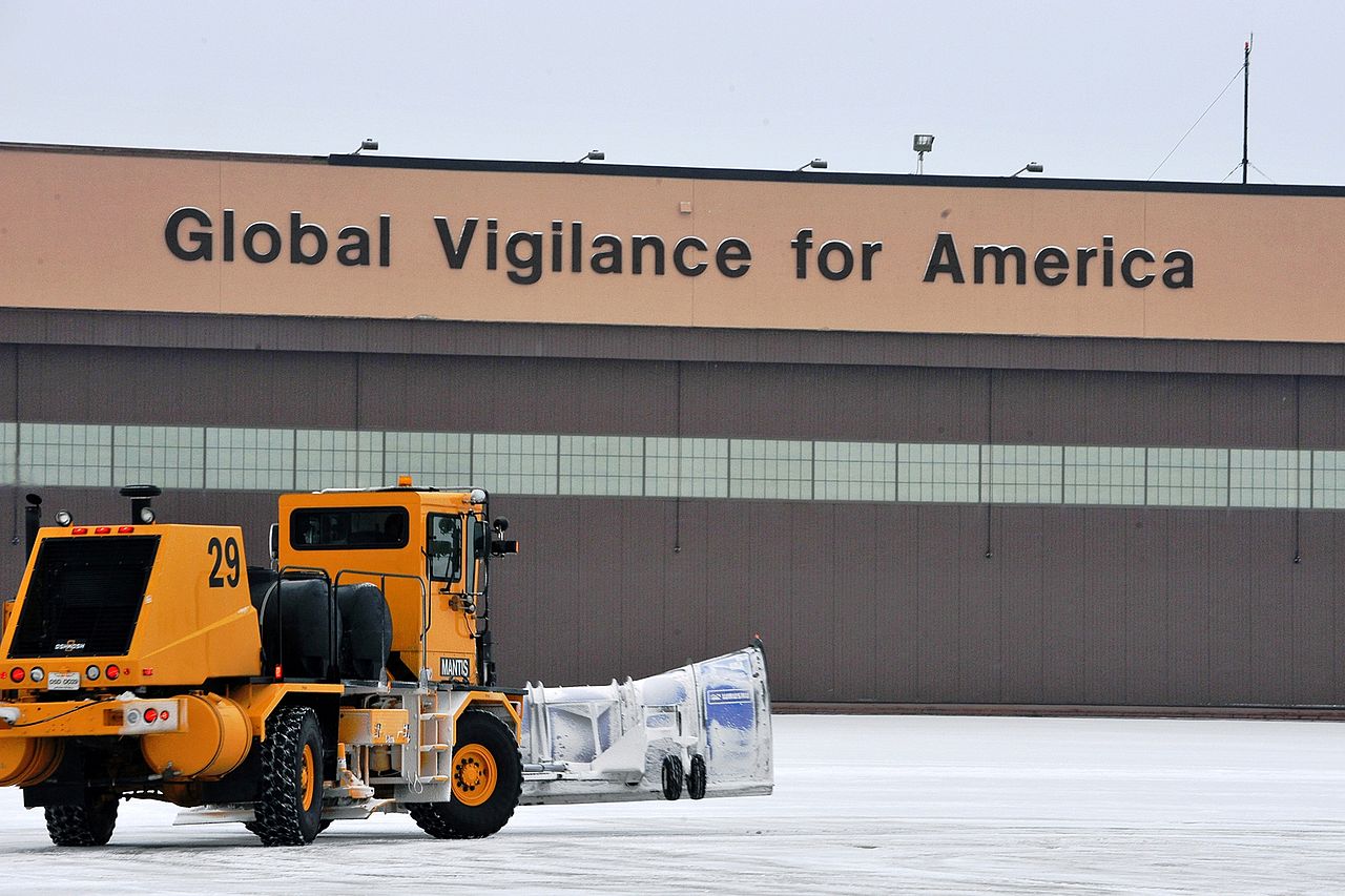 A Snowplow clears snow on the flight line at Offutt Air Force Base.