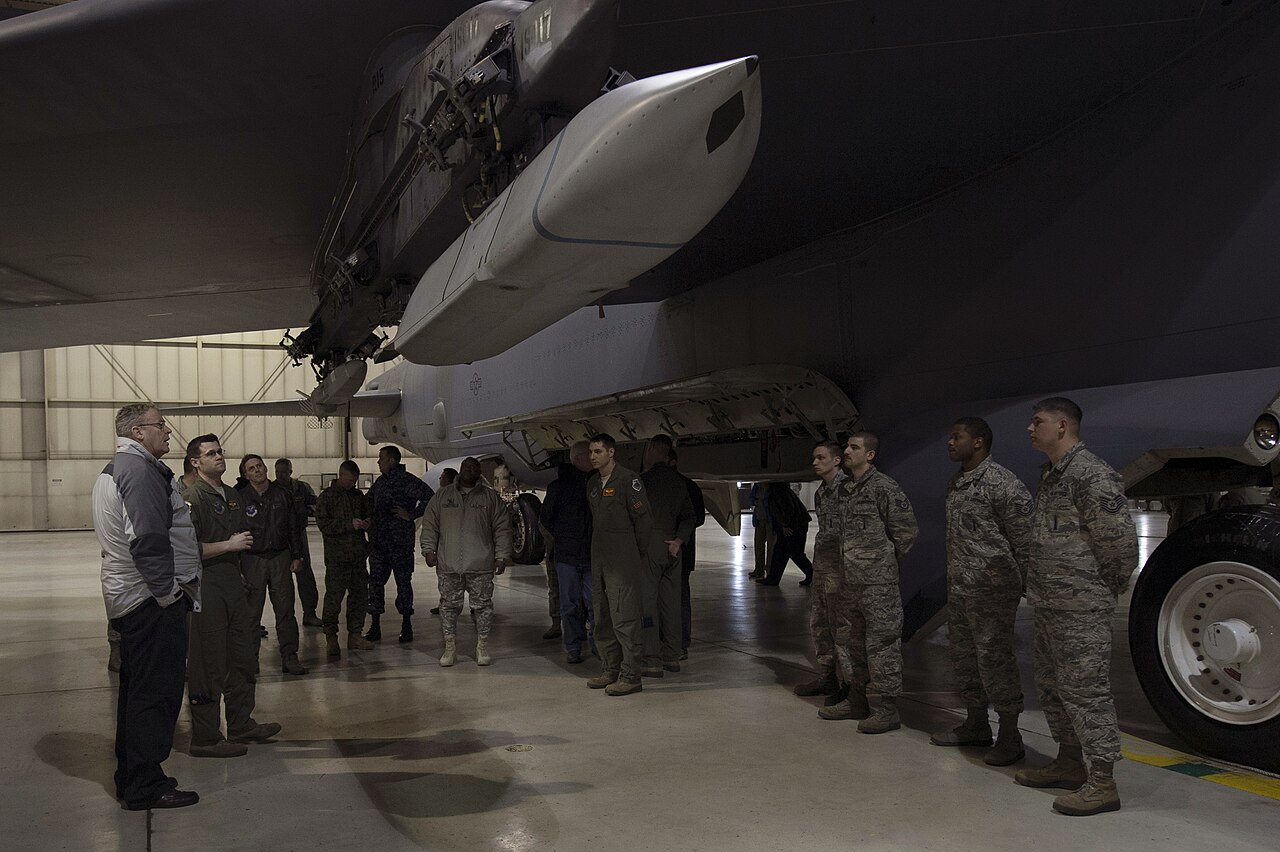 Deputy Secretary of Defense Bob Work tours a B-52 aircraft hangar used for weapon loading training at Minot Air Force Base, ND., as he visits the base to meet with nuclear enterprise Airman, Feb. 11, 2015.