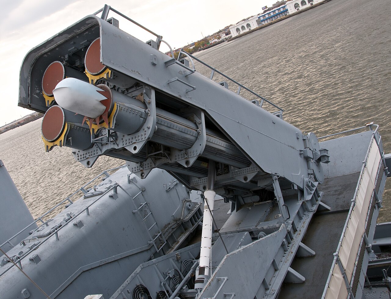 A Tomahawk cruise missile protrudes from an All-Up-Round (AUR) canister. Four canisters are contained in a Mark 143 Armored Box Launcher, which protected the missiles from damage prior to launch.
