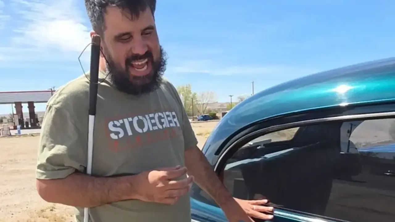 Blind man recognizes cars.