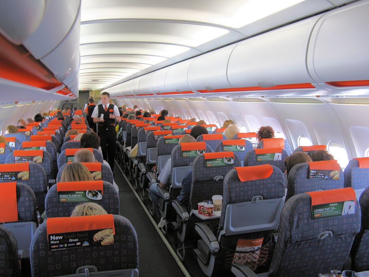 The cabin of an Easyjet Airbus A319-100 (G-EZAV) in flight from Palma Airport, Majorca, Spain to Bristol Airport, England.