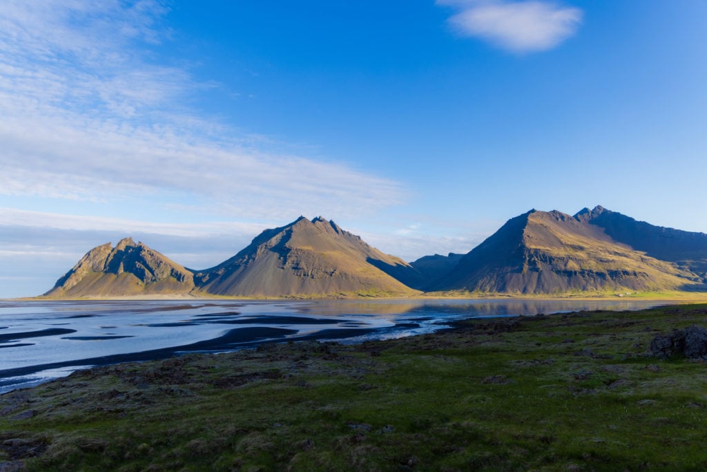 The mountains rising off of the beaches in East Iceland.