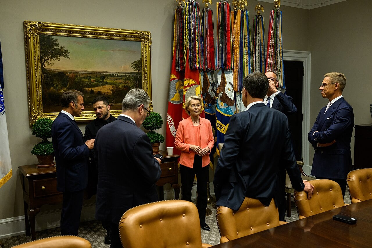 President Emmanuel Macron, Ukrainian President Volodymyr Zelenskyy, European Commission President Ursula von der Leyen, German Chancellor Friedrich Merz, Finnish President Alexander Stubb, Secretary General Mark Rutte of NATO, and U.K. Prime Minister Keir Starmer wait in the Roosevelt Room as President Donald Trump makes a call with Russian President Vladimir Putin in the Oval Office, Monday, August 18, 2025.