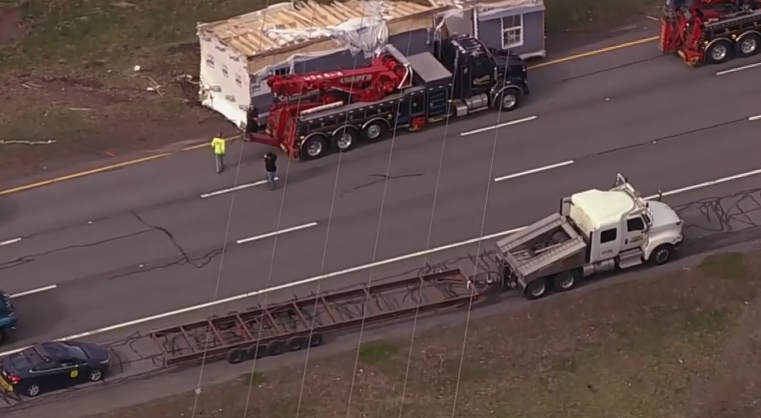 mobile home on road after three car crash