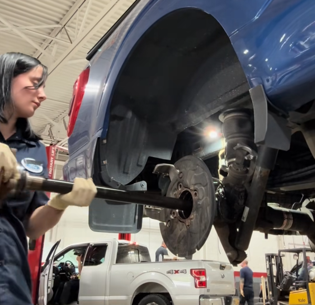 woman fixing f-150