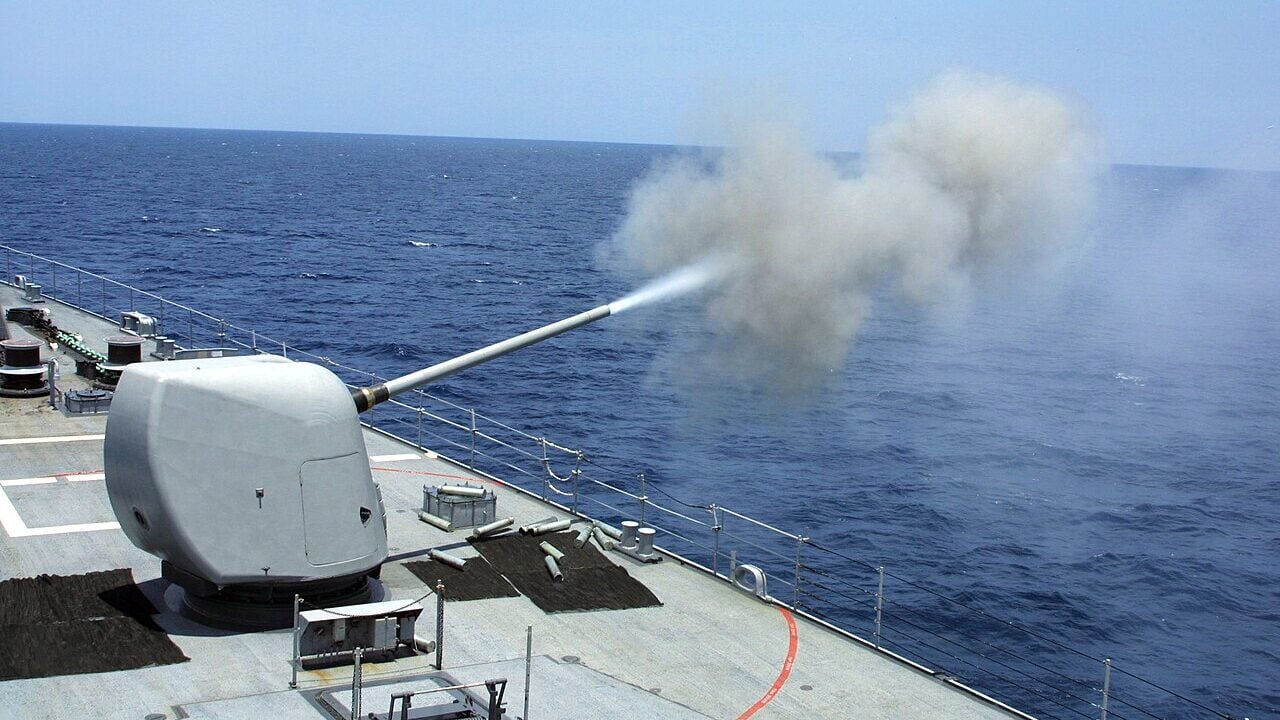 The guided missile destroyer USS Spruance (DDG 963) fires its 5” 54 gun during a three-day exercise in the Central Arabian Gulf.
