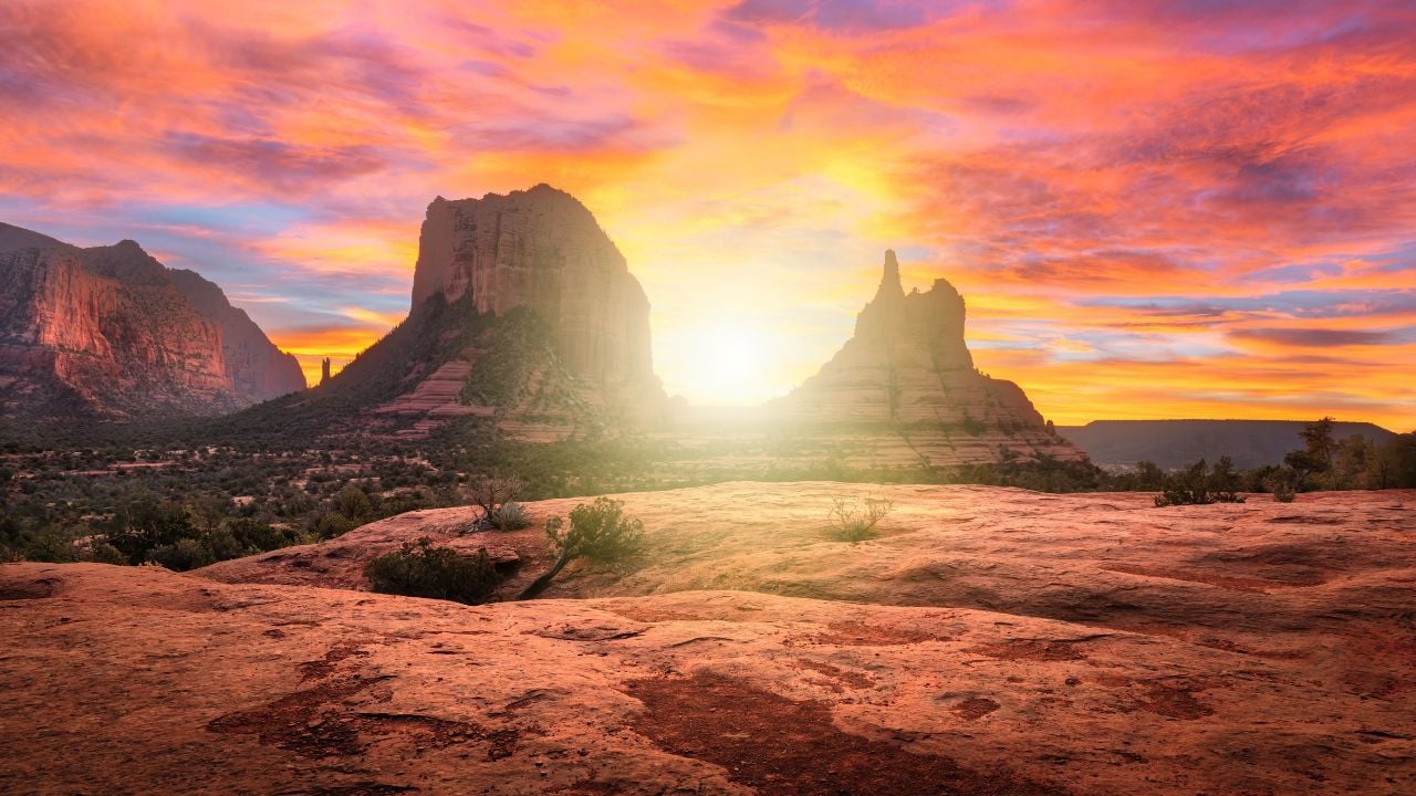 A scenic view of sunrise over Sedona's red rock formations