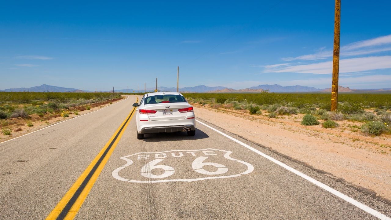 White sedan on historic Route 66 in the California desert