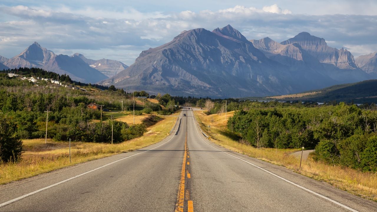 Scenic highway with Rocky Mountain landscape near St. Mary, Montana