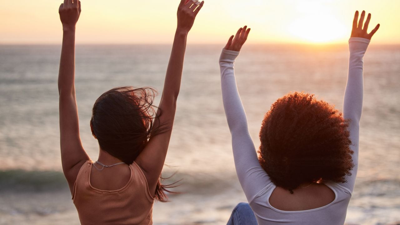 Freedom, beach sunset and couple of friends on road trip by car with back and arms in air. Transport, vacation and holiday fun together by the sea and ocean on spring break on adventure in Florida