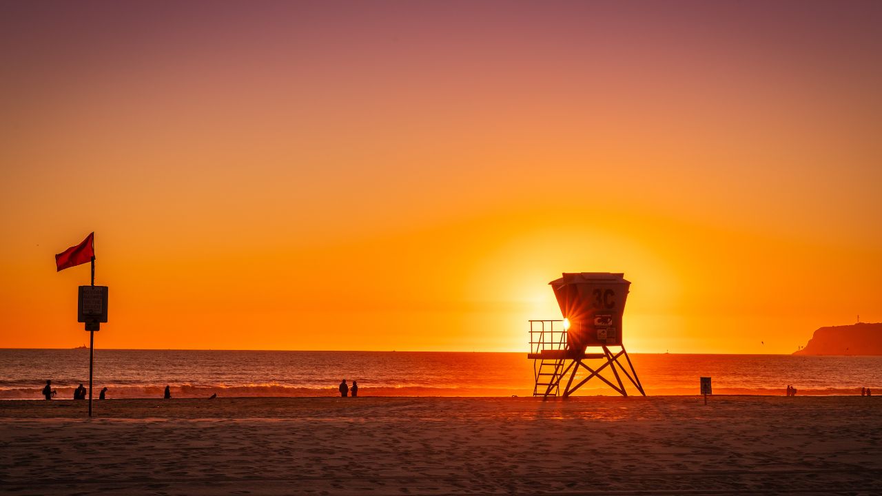 Lifeguard hut silhouette at sunset on Coronado Beach