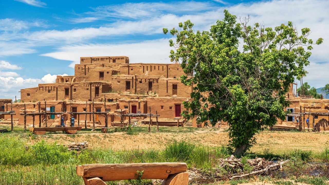 TAOS, NEW MEXICO, USA - JUNE 25, 2019: Tourists visit the historic Taos Pueblo.