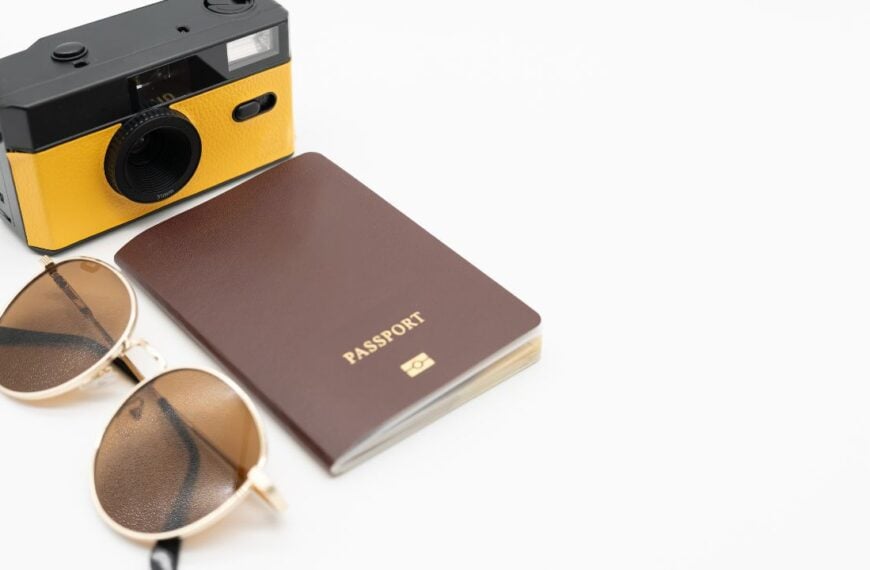 Vintage camera, Passport with Sunglasses. Minimal hipster summer trend. Retro design camera for travel. Summertime concept. Travel, Holiday, Vacation in summer concept.