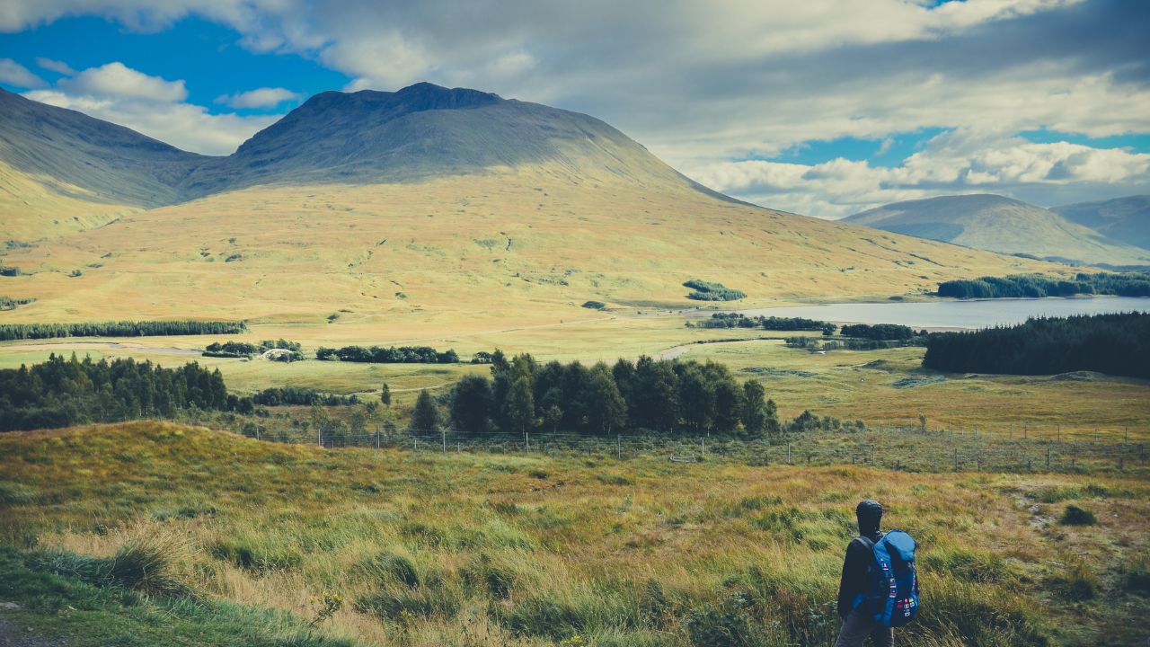 Traveler in the Scottish Highlands in spring