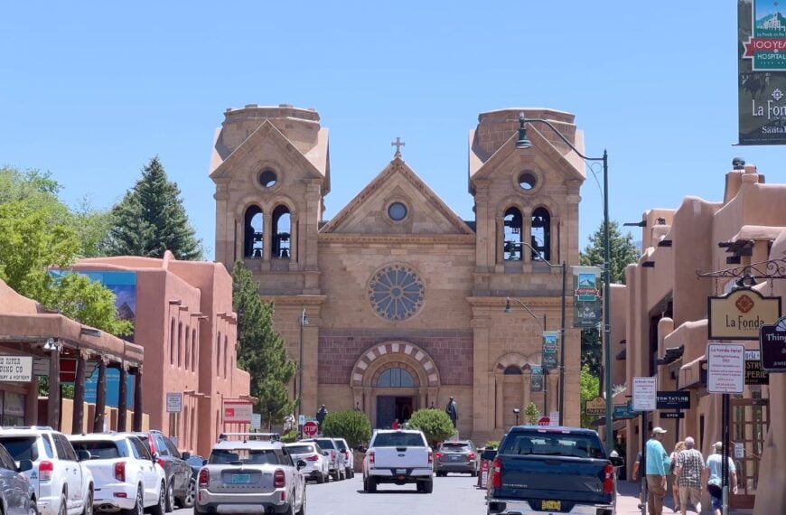 Santa Fe, New Mexico, USA-June 11, 2024-Slow motion-A captivating view of the historical downtown area of Santa Fe, New Mexico, showcasing the iconic La Fonda Hotel and the Cathedral Basilica of St