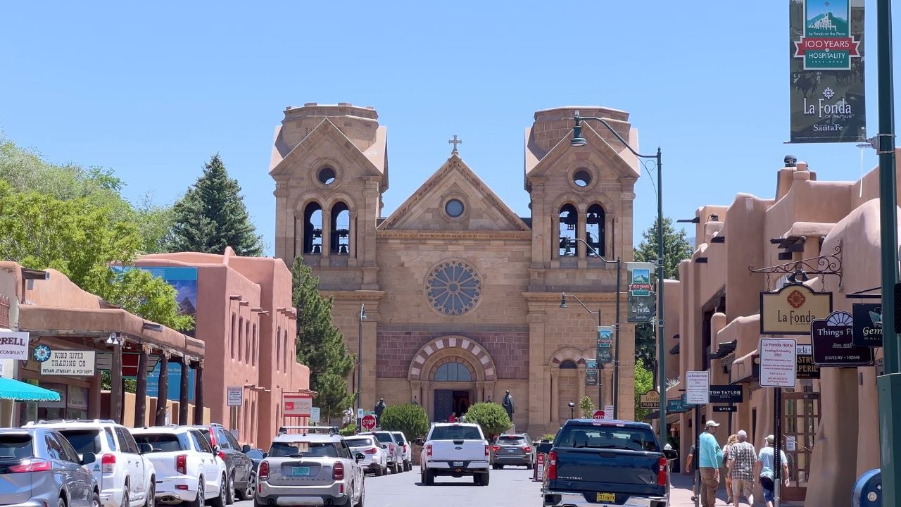 Santa Fe, New Mexico, USA-June 11, 2024-Slow motion-A captivating view of the historical downtown area of Santa Fe, New Mexico, showcasing the iconic La Fonda Hotel and the Cathedral Basilica of St