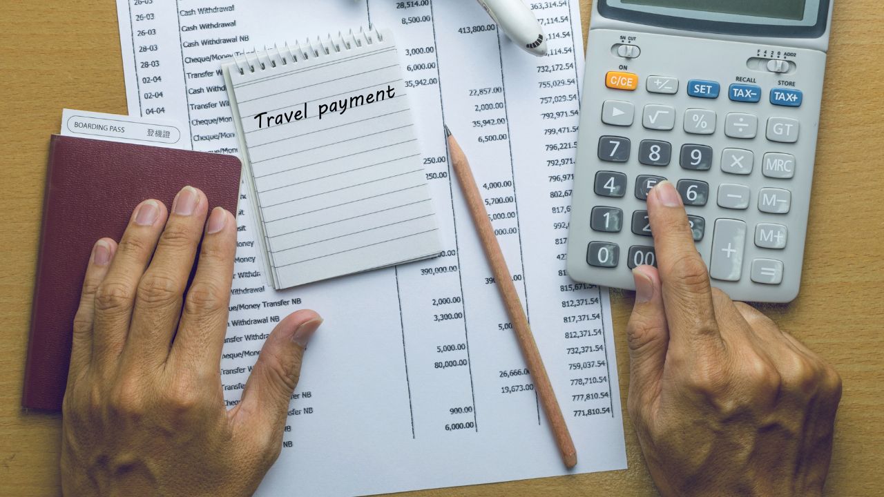 Man planning travel payments and budget