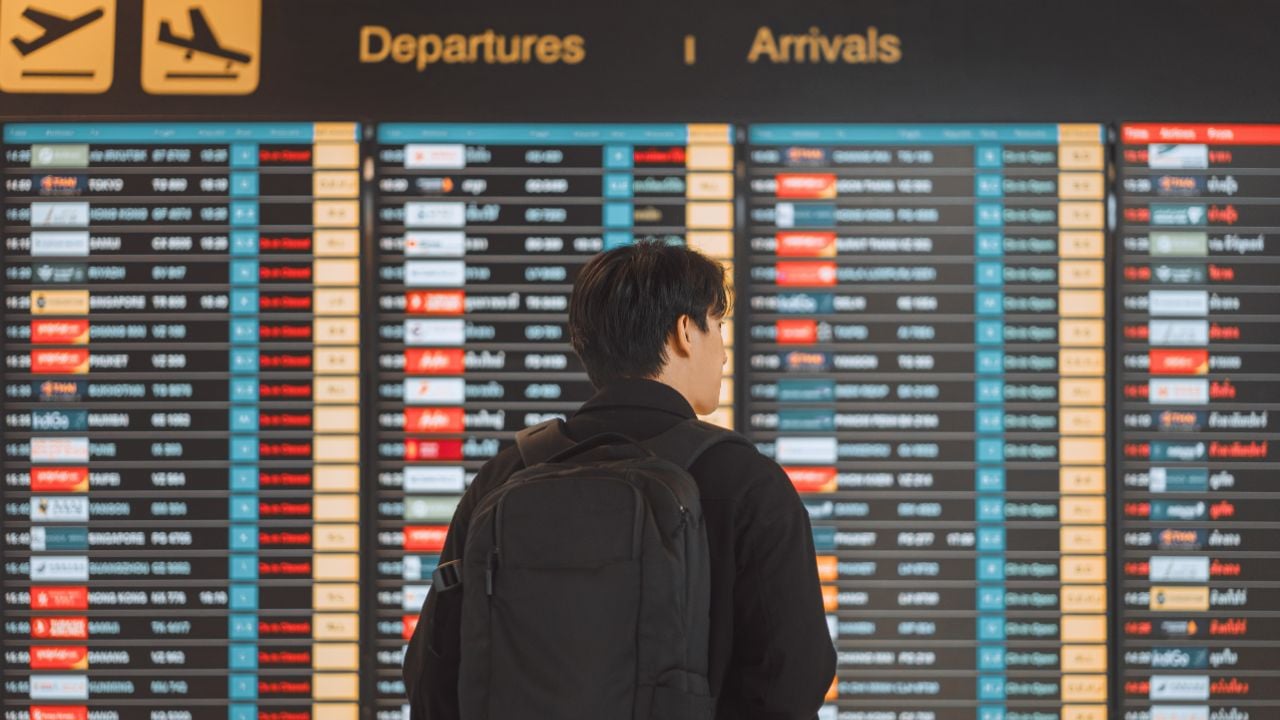 Traveler in an airport terminal with luggage