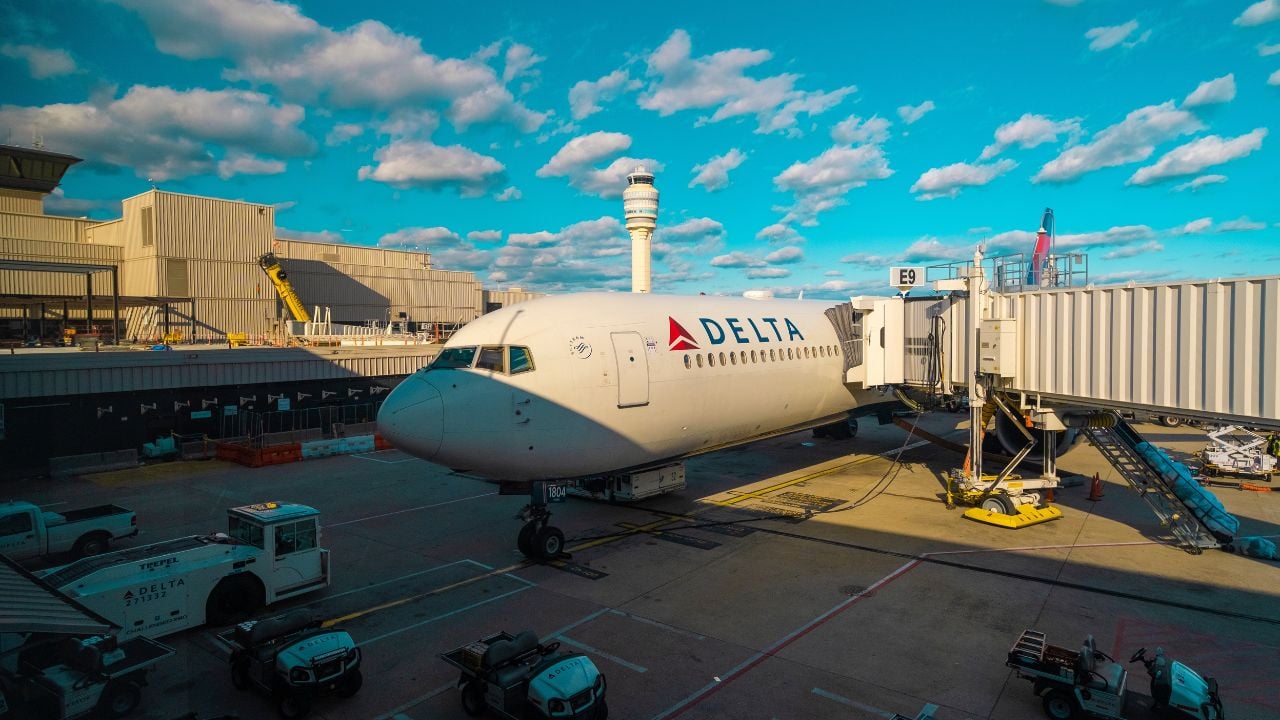 Airplanes parked at gates at an airport hub
