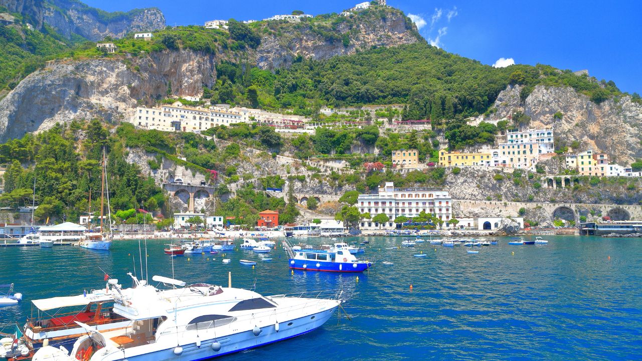 Leisure boats inside the harbor of Amalfi town, Amalfi coast, Italy
