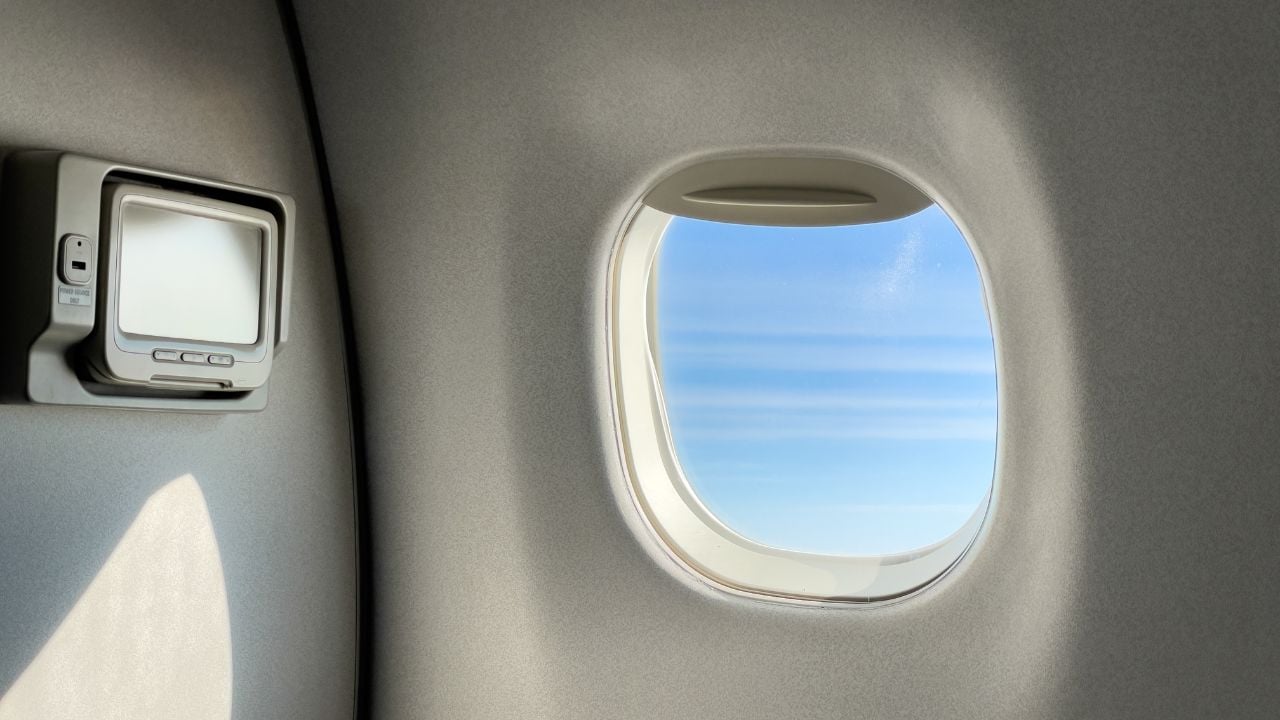 View from an airplane passenger window inside the cabin.