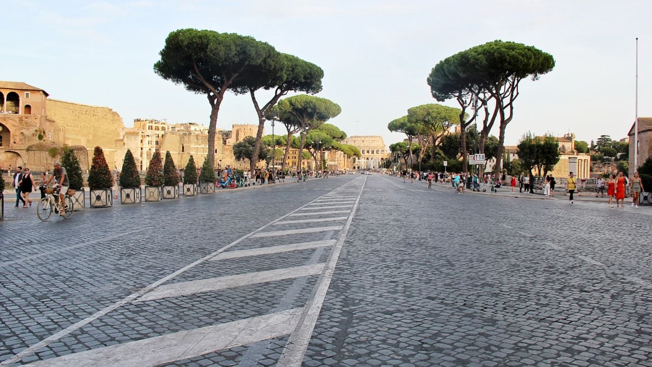 Via dei Fori Imperiali and the Colosseum in Rome, Italy.