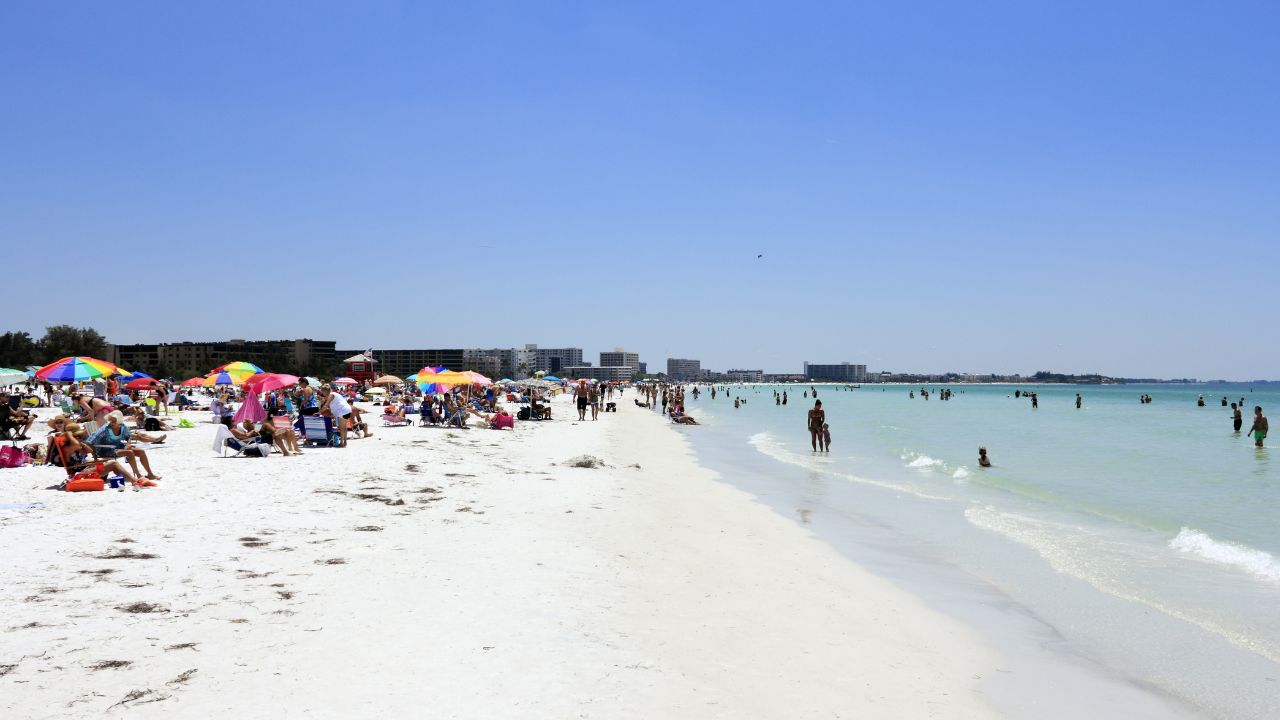 Beachgoers on Siesta Beach in Florida.